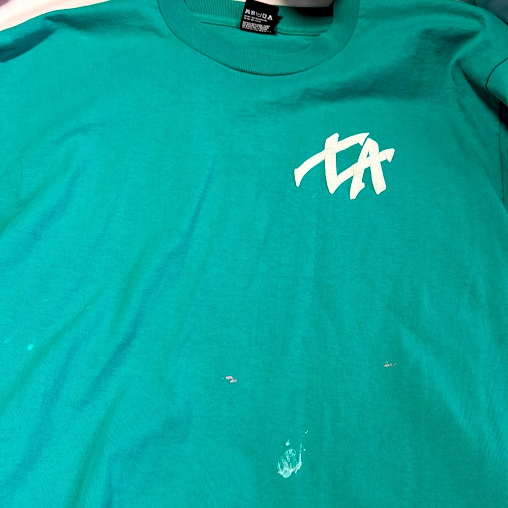 Green ish blue t shirt